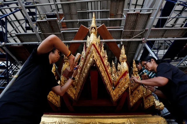 Thai officials from the Conservation Science Division of the Fine Arts Department of the National Museum of Thailand repairs the Minor Chariot, which will be used during the late King  Bhumibol Adulyadej's funeral later this year, Thailand, February 6, 2017. (Photo by Chaiwat Subprasom/Reuters)