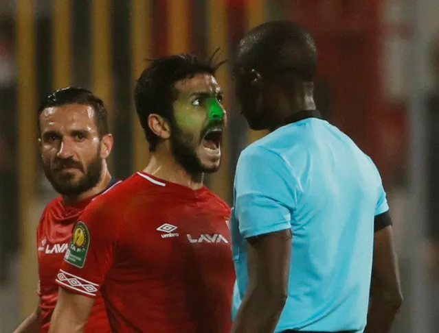 Al-Ahly's Ayman Ashraf is shown a yellow card by referee Bakary Gassama during the second leg of the CAF Champions League quarter final football match between Egypt's Al-Ahly and South Africa's Mamelodi Sundowns at the Borg El Arab Stadium in Borg El Arab, near Alexandria on April 13, 2019. (Photo by Amr Abdallah Dalsh/Reuters)