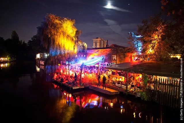 Guests spend the evening in the beach bars in Berlin, Germany