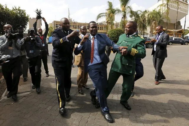 Kenyan Member of Parliament for Ugujna Constituency Opiyo Wandayi (C) is ejected from the National Assembly for blowing whistles during President Uhuru Kenyatta's annual State of the Nation address at the Parliament Buildings in the capital Nairobi, March 31, 2016. (Photo by Thomas Mukoya/Reuters)