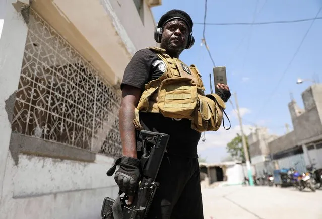Former police officer Jimmy “Barbecue” Cherizier, and leader of an alliance of armed groups, speaks to a news outlet on a mobile phone during a news conference, in Port-au-Prince, Haiti, on March 11, 2024. (Photo by Ralph Tedy Erol/Reuters)