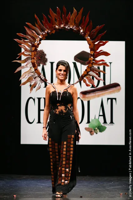 Karine Ferri displays a chocolate decorated dress during the Chocolate dress fashion show