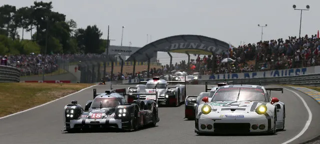 The Porsche 919 Hybrid No18 of the Porsche Team driven Neel Jani of Switzerland is seen in action during the 83rd 24-hour Le Mans endurance race, in Le Mans, western France, Saturday, June 13, 2015. (AP Photo/David Vincent)