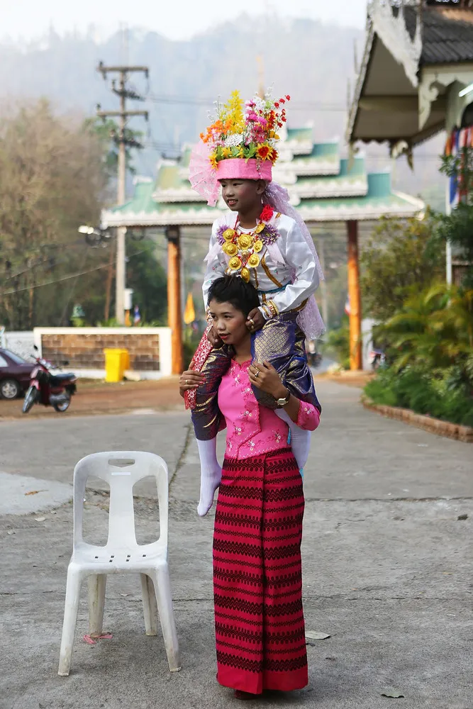 Young Thais Ordained into Buddhism