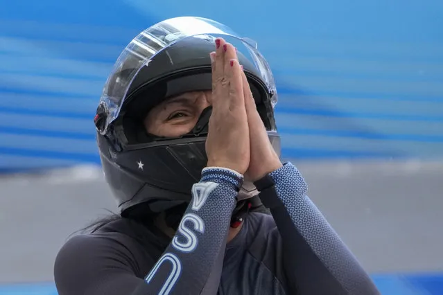 Elana Meyers Taylor, of the United States, celebrates after the finish during the women's monobob heat 4 at the 2022 Winter Olympics, Monday, February 14, 2022, in the Yanqing district of Beijing. (Photo by Pavel Golovkin/AP Photo)