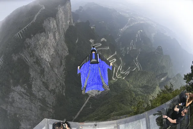 A wingsuit flier takes part in a test flight ahead of 2019 World Wingsuit League (WWL) China Grand Prix at Tianmen Mountain on September 3, 2019 in Zhangjiajie, Hunan Province of China. Sixteen wingsuit fliers from 11 countries will participate in the 2019 World Wingsuit League (WWL) China Grand Prix in Zhangjiajie on September 5-8. (Photo by Shao Ying/VCG via Getty Images)