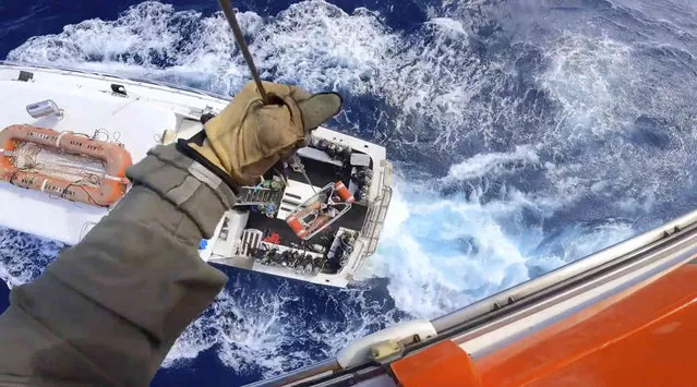 This image provided by U.S. Coast Guard a Coast Guard Air Station Miami MH-65 Dolphin helicopter crew rescues a man after he was bitten by a shark while fishing aboard a vessel near Bimini, Bahamas, on Monday, February 21, 2022. The man was taken to Jackson Memorial Hospital in Miami, where he was in stable condition.  (Photo by U.S. Coast Guard via AP Photo)