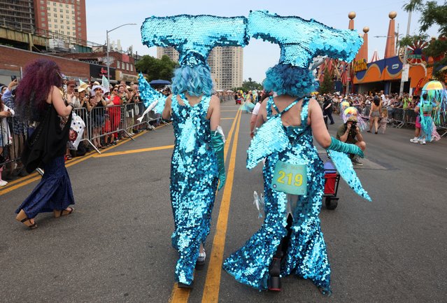 People participate in the Mermaid Parade during a heatwave in Coney Island, Brookly, New York City, U.S., June 22, 2024. (Photo by Caitlin Ochs/Reuters)