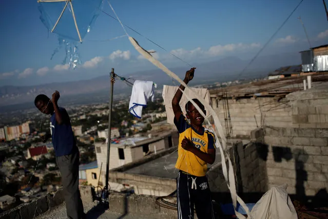 Children fly kites in a neighborhood of Port-au-Prince, Haiti, February 8, 2017. (Photo by Andres Martinez Casares/Reuters)