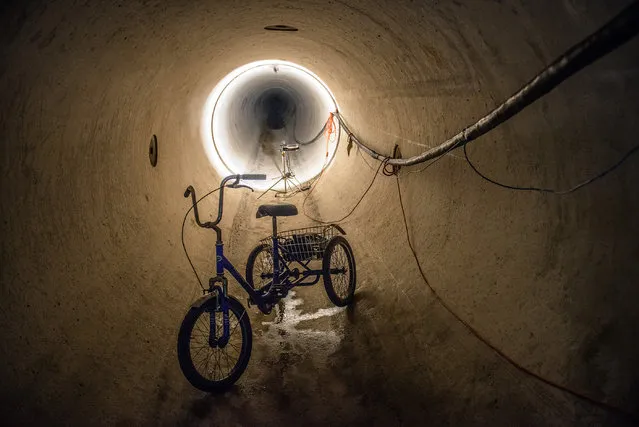 WSSC allows visitors to its water main project that links Montgomery to Prince Georges on May, 14, 2014 in Kensington, MD. Pictured, a view down the pipe. The bike in the foreground is used by inspectors to traverse the more than 5 miles of pipe. (Photo by Bill O'Leary/The Washington Post)