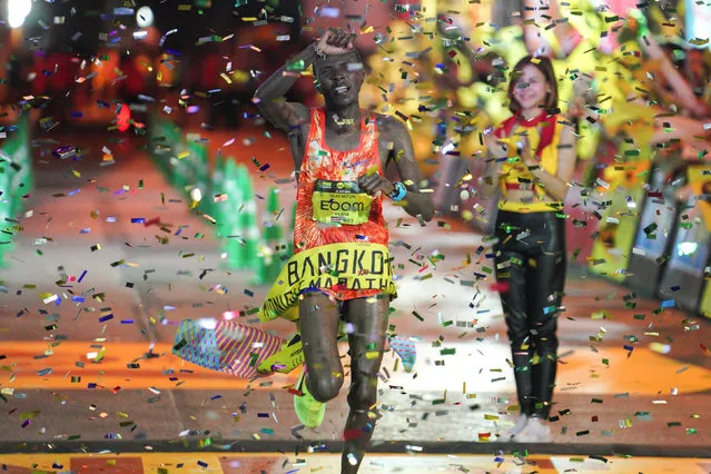 Kenya's Silas Muturi celebrates after winning the men's elite of Thailand's first Midnight Marathon in Bangkok, Thailand May 21, 2017. (Photo by Athit Perawongmetha/Reuters)