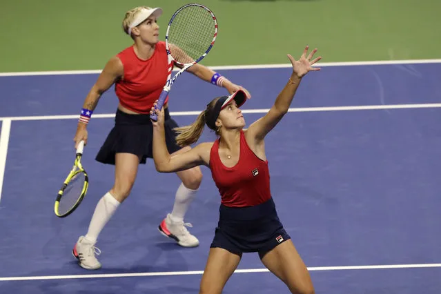 United States' Sofia Kenin prepares to hit an overhead as she and Bethanie Mattek-Sands play Latvia's Jelena Ostapenko and Anastasija Sevastova during the doubles match in Fed Cup tennis qualifying tie Saturday, February 8, 2020, in Everett, Wash. (Photo by Elaine Thompson/AP Photo)