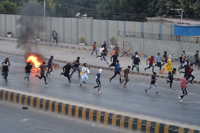 Flames rise from a motercycle set on fire during a protest by the supporters of Shi'ite Muslims bodies, rallying to protest the killing of Hezbollah leader Hassan Nasrallah during an anti-Israel protest in Karachi, Pakistan, 29 September 2024. The Israeli army (Tsahal) said on 28 September 2024 on X (formerly Twitter) that Hezbollah leader Hassan Nasrallah was killed in an overnight strike on Beirut. Hezbollah confirmed the death of Nasrallah in a statement on 28 September 2024. (Photo by Shahzaib Akber/EPA/EFE)