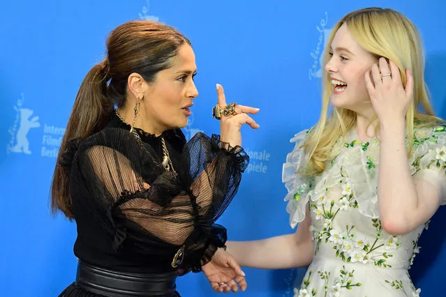 (L-R) Mexican-US actress Salma Hayek and US actress Elle Fanning pose during a photocall for the film “The Roads Not Taken” screened in competition on February 26, 2020 at the 70th Berlinale film festival in Berlin. (Photo by Tobias Schwarz/AFP Photo)