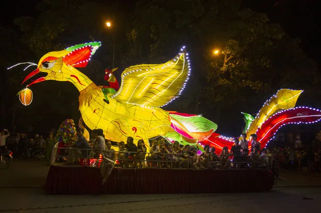 A phoenix lantern float parades through the streets to celebrate the Mid-Autumn, or Moon festival in Tuyen Quang city, Vietnam, Monday, October 2, 2017. (Photo by Hau Dinh/AP Photo)