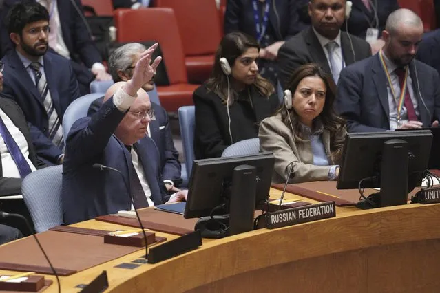 Russian Ambassador to the United Nations Vasily Nebenzya raises his hand against a U.N. Security Council vote on a draft resolution sanctioning Russia's planned annexation of war-occupied Ukraine territory, Friday September 30, 2022 at U.N. headquarters. (Photo by Bebeto Matthews/AP Photo)