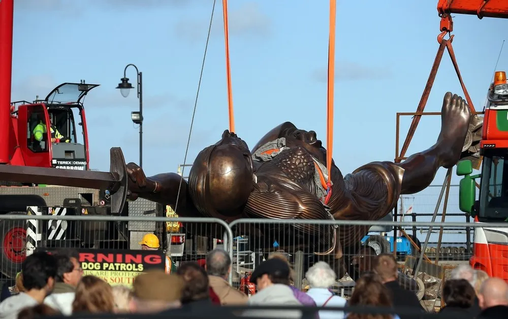 Damien Hirst's Giant Bronze Sculpture Of A Pregnant Woman “Verity” Is Erected In Ilfracombe