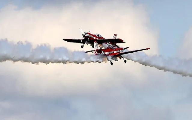 The Polish aerobatic team “Zelezny” perform during the “Subcarpathian Air Show” in Mielec, southern Poland, Sept.12, 2015. (Photo by Darek Delmanowicz/EPA)