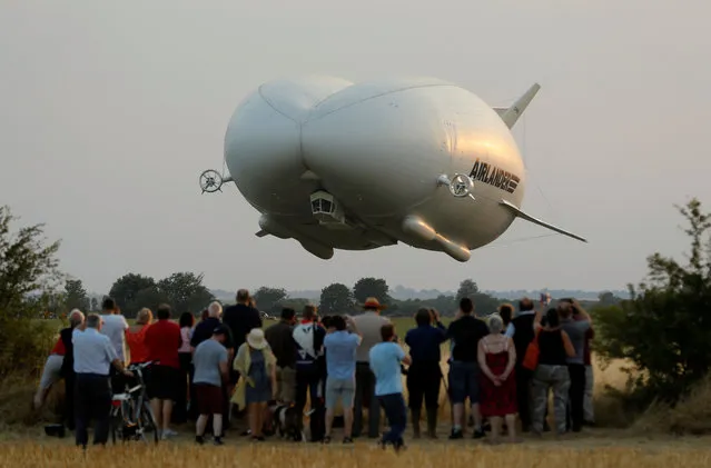 The Airlander 10 hybrid airship makes its maiden flight at Cardington Airfield in Britain, August 17, 2016. (Photo by Darren Staples/Reuters)