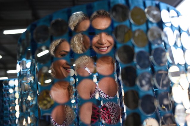 Bruna Benevides, President of Brazil's National Association of Travestis and Transsexuals (ANTRA), is reflected in a mirror piece that will be part of a Carnival float of the Paraiso do Tuiuti samba school, at the warehouse in the Samba City complex, in Rio de Janeiro, Brazil, on February 19, 2025. (Photo by Tita Barros/Reuters)