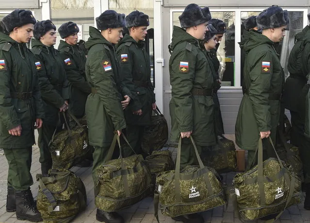 Russian conscripts pictured at a railway station in Sevastopol before leaving to serve in the war, Crimea, 09 November 2022. In 2022, as part of the autumn conscription, the number of those called up for military service will be 120 thousand people. Male citizens of the Russian Federation aged 18 to 27 who have not previously completed military service fall under the autumn draft. Conscripts of the autumn conscription will not be sent to serve in the DPR, LPR, Zaporizhzhia and Kherson regions. (Photo by EPA/Stringer)