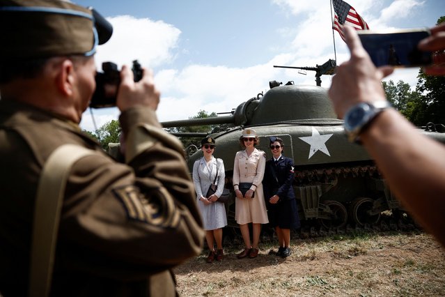 World War II reenactors gather ahead of the 80th anniversary of the 1944 D-Day landings in Sainte-Mere-Eglise, Normandy region,France, on June 2, 2024. (Photo by Benoit Tessier/Reuters)
