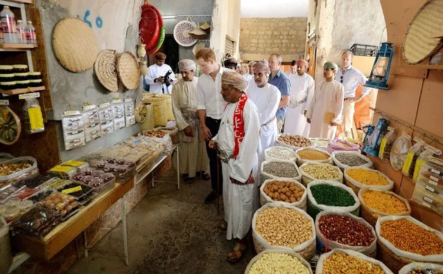 Prince Harry enjoys strolling through a Souk (market) during a visit to the Nizwa Fort in Oman, on the second day of his three day visit to the middle east, on November 19, 2014. (Photo by John Stillwell/PA Wire)