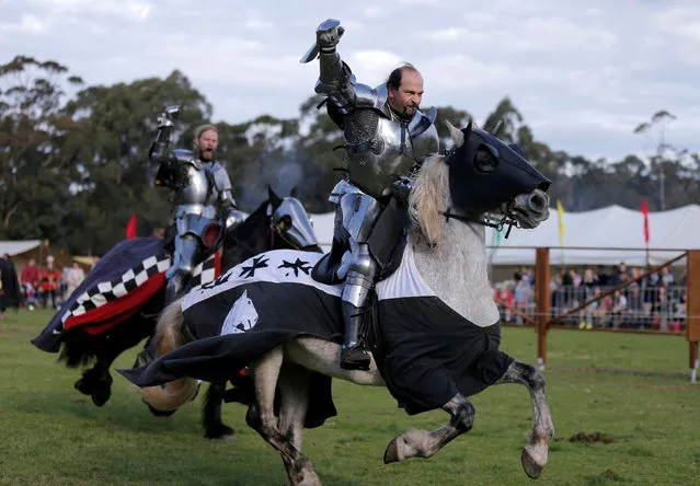 Australian jousting knight Cliff Marisma acknowledges the crowd on his way to winning the final of the jousting competition at the St Ives Medieval Fair in Sydney, one of the largest of its kind in Australia, September 25, 2016. (Photo by Jason Reed/Reuters)