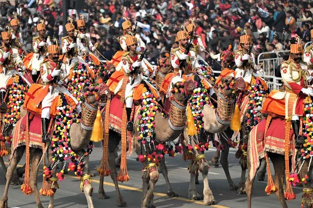 Indian Border Security Force (BSF) soldiers ride their camels during the full dress rehearsal for the upcoming Republic Day parade, in New Delhi on January 23, 2023. (Photo by Money Sharma/AFP Photo)