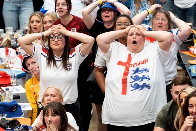 England fans react as they watch a live broadcast of the Women's Euro final football match between England and Spain, at Boxpark Wembley in London on July 27, 2025. (Photo by Niklas Halle'n/AFP Photo)