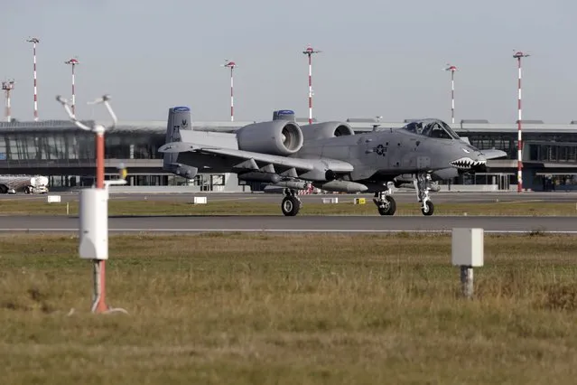U.S. Army A-10 Thunderbolt II aircraft lands at Riga International airport, Latvia, October 28, 2015. (Photo by Ints Kalnins/Reuters)