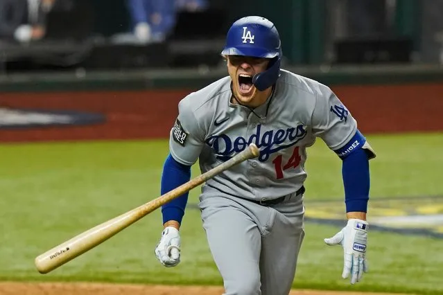 Los Angeles Dodgers' Enrique Hernandez celebrates a RBI-double against the Tampa Bay Rays during the sixth inning in Game 4 of the baseball World Series Saturday, October 24, 2020, in Arlington, Texas. (Photo by Eric Gay/AP Photo)