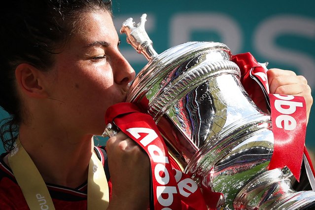 Manchester United's Spanish forward #17 Lucia Garcia kisses the FA cup Trophy as she celebrates after winning with her team the English Women's FA Cup final football match between Manchester United and Tottenham Hotspur at Wembley Stadium, in north west London, on May 12, 2024. (Photo by Adrian Dennis/AFP Photo)