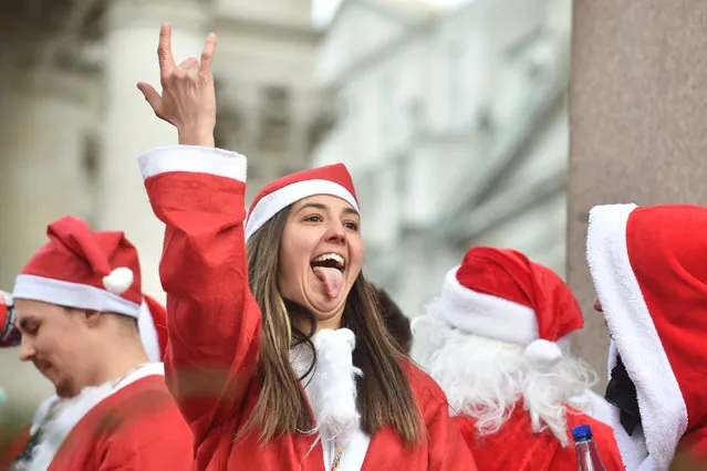 Thousands of Christmas revellers dressed up as Santa Claus and partied in the streets of London for an annual festive pub crawl yesterday,  December 14, 2019. Boozy Brits donned their Father Christmas outfits and hit the capital's bars for Santacon, which takes place on a Saturday every December. (Photo by Backgrid UK)