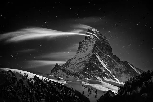 “Matterhorn: Night Clouds”. The Matterhorn 4478 m at full moon. Location: Zermatt, Switzerland. (Photo and caption by Nenad Saljic/National Geographic Traveler Photo Contest)