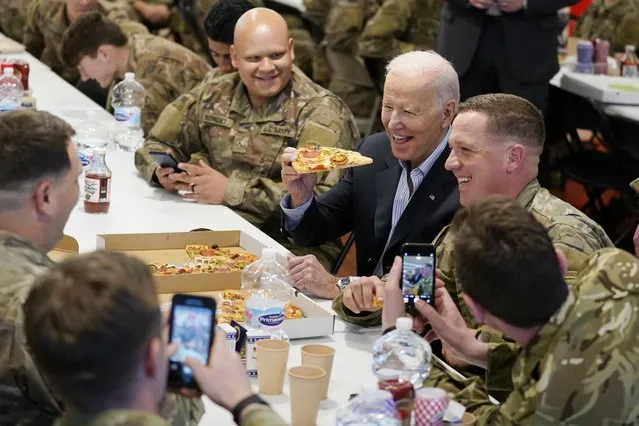 President Joe Biden visits with members of the 82nd Airborne Division at the G2A Arena, Friday, March 25, 2022, in Jasionka, Poland. (Photo by Evan Vucci/AP Photo)