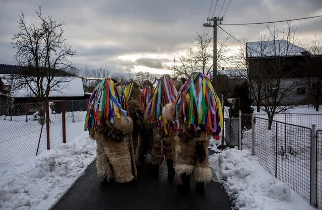 Participants dressed in traditional devil costumes walk from house to house during the traditional St. Nicholas parade on December 3, 2016 in village of Francova Lhota, Czech Republic. (Photo by Matej Divizna/Getty Images)