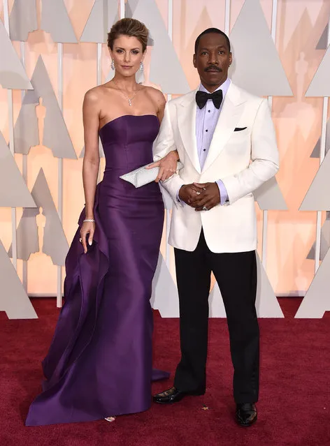 Paige Butcher, left, and Eddie Murphy arrive at the Oscars on Sunday, February 22, 2015, at the Dolby Theatre in Los Angeles. (Photo by Jordan Strauss/Invision/AP Photo)