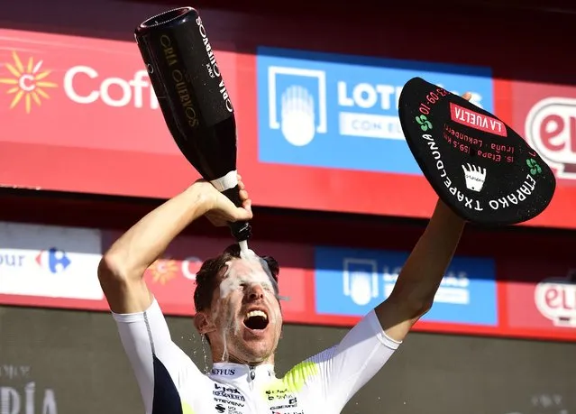 Team Intermarche Wanty's Portuguese rider Rui Costa celebrates on the podium winning the stage 15 of the 2023 La Vuelta cycling tour of Spain, a 158,3 km race between Pamplona and Lekunberri on September 10, 2023. (Photo by Ander Gillenea/AFP Photo)