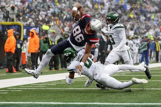 New England Patriots tight end Pharaoh Brown (86) pushes for the end zone against New York Jets safety Adrian Amos (0) to score a touchdown during the second quarter of an NFL football game, Sunday, September 24, 2023, in East Rutherford, N.J. (Photo by Adam Hunger/AP Photo)