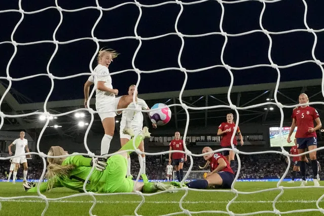 England's Beth Mead, center left, scores her third goal, England's 8th, during the Women Euro 2022 group A soccer match between England and Norway at Brighton & Hove Community Stadium in Brighton, England, Monday, July 11, 2022. England won 8-0. (Photo by Alessandra Tarantino/AP Photo/File)