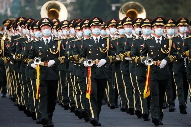 Military band members rehearse before the event marking the 100th founding anniversary of the Communist Party of China, on Tiananmen Square in Beijing, China on July 1, 2021. (Photo by Carlos Garcia Rawlins/Reuters)