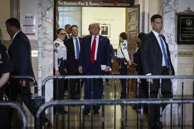 Former President Donald Trump leaving the courtroom during a break in his civil business fraud trial at New York Supreme Court, Tuesday, October 17, 2023, in New York. (Photo by Stefan Jeremiah/AP Photo)