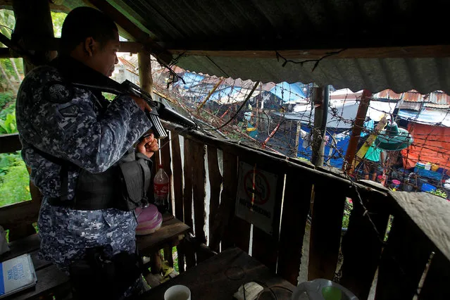 A prison guard stands guard in a watch tower in the prison compound following the escape of more than 150 inmates after gunmen stormed the prison in North Cotabato province, southern Philippines January 4, 2017. (Photo by Marconi Navales/Reuters)