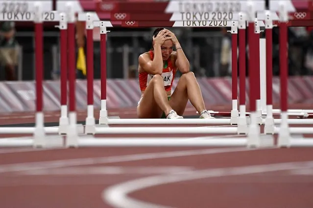 Hungary's Luca Kozak reacts after falling in the women's 100m hurdles semi-finals during the Tokyo 2020 Olympic Games at the Olympic Stadium in Tokyo on August 1, 2021. (Photo by Jewel Samad/AFP Photo)