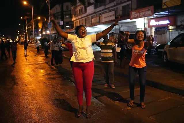 Residents celebrate in Kinshasa, Congo, Thursday January 10, 2019, after learning that opposition presidential candidate Felix Tshisekedi had been declared the winner of the elections. (Photo by Jerome Delay/AP Photo)