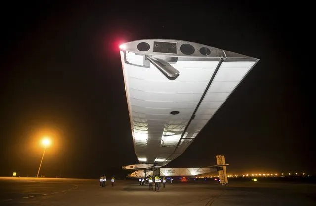 The Solar Impulse 2 plane is seen on the tarmac before taking off at Chongqing Jiangbei International Airport, to fly to Nanjing in Jiangsu province, April 21, 2015. Pilots Bertrand Piccard and Andre Borschberg are taking turns at the controls of Solar Impulse 2, which began its journey in Abu Dhabi in the United Arab Emirates on March 9. (Photo by Reuters/Stringer)