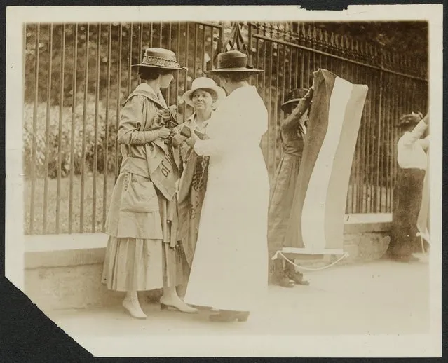 A policewoman (right) arrests Florence Youmans (left) of Minnesota and Annie Arniel of Delaware for refusing to give up their banners while picketing for women's voting rights outside the White House in Washington DC, June 1917, in this Library of Congress handout photo. Arniel was one of the first six suffrage prisoners and served eight separate jail sentences for Watchfire demonstrations. (Photo by Reuters/Bain Collection/Library of Congress)