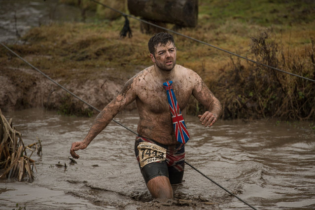 A competitor takes part in the “Tough Guy” adventure race near Wolverhampton, central England, on January 29, 2017. (Photo by Oli Scarff/AFP Photo)