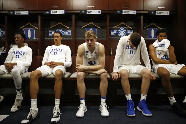 Duke guard Mike Buckmire, from left, forward Justin Robinson, forward Jack White, center Antonio Vrankovic and center Marques Bolden sit in the Duke locker room after an NCAA men's East Regional final college basketball game against Michigan State, Sunday, March 31, 2019, in Washington. Michigan State won 68-67. (Photo by Patrick Semansky/AP Photo)